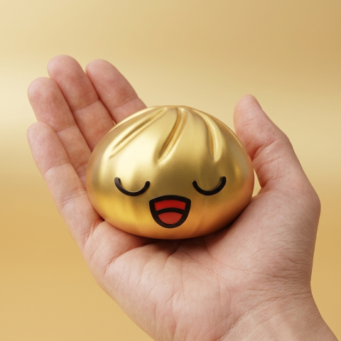 Rare Dumpling Squishy Złoty Skarb w dłoni — porównanie rozmiaru