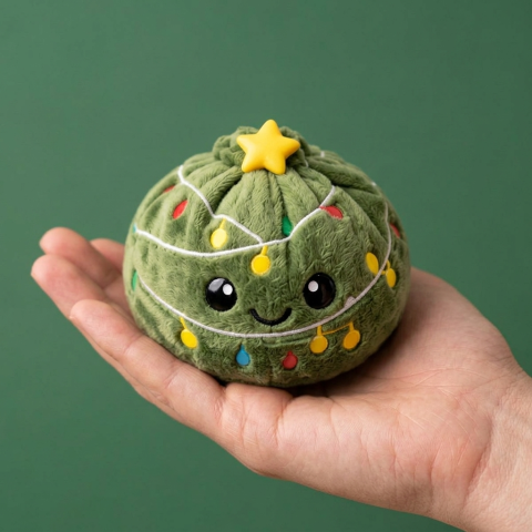 Dumpling Squishy Choinka ze Światełkami w dłoni — porównanie rozmiaru