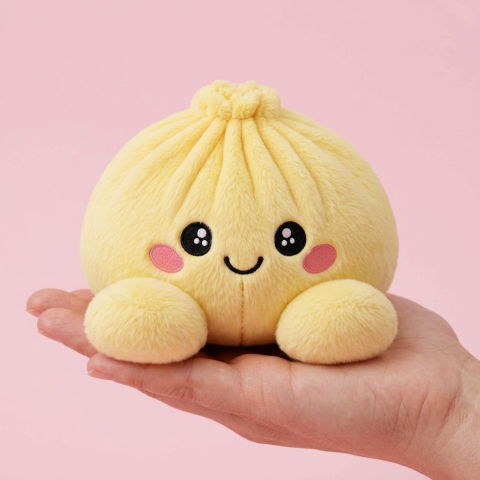 Dumpling Squishy Żółty Cytrynowy w dłoni — porównanie rozmiaru